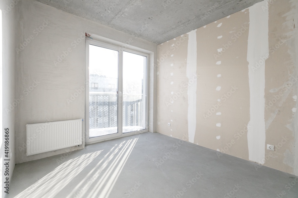 interior of the apartment without decoration in gray colors. rough finish interior of the apartment without decoration in gray colors. rough finish