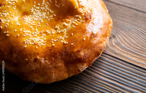 uzbek tortillas on an old wooden background, top view photo