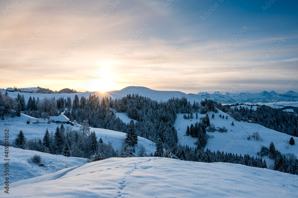 a winter sunrise over the idyllic hills of Emmental