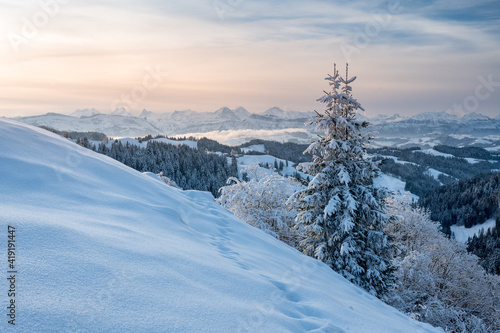 winter landscape in Emmental and Eiger Mönch and Jungfrau in the distance