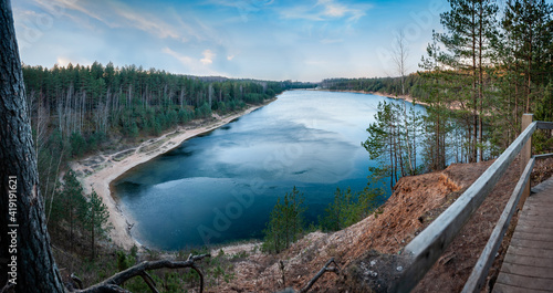 View to the Dubkalni Reservoir in Blue Hills of Ogre (Ogre Zilie Kalni). Nature Park with beautiful blue lake and pine forest. Latvia. Panorama. photo