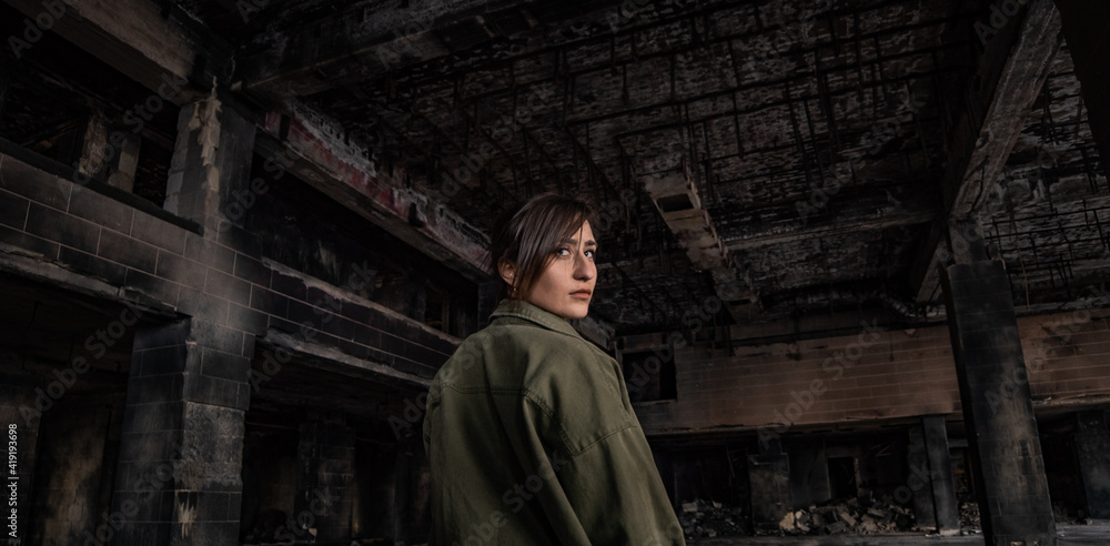Portrait of a girl at the burned abandoned old hotel in Malta