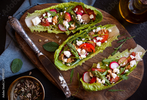 Vegetable salad served in lettuce leaves, light and healthy food or snack