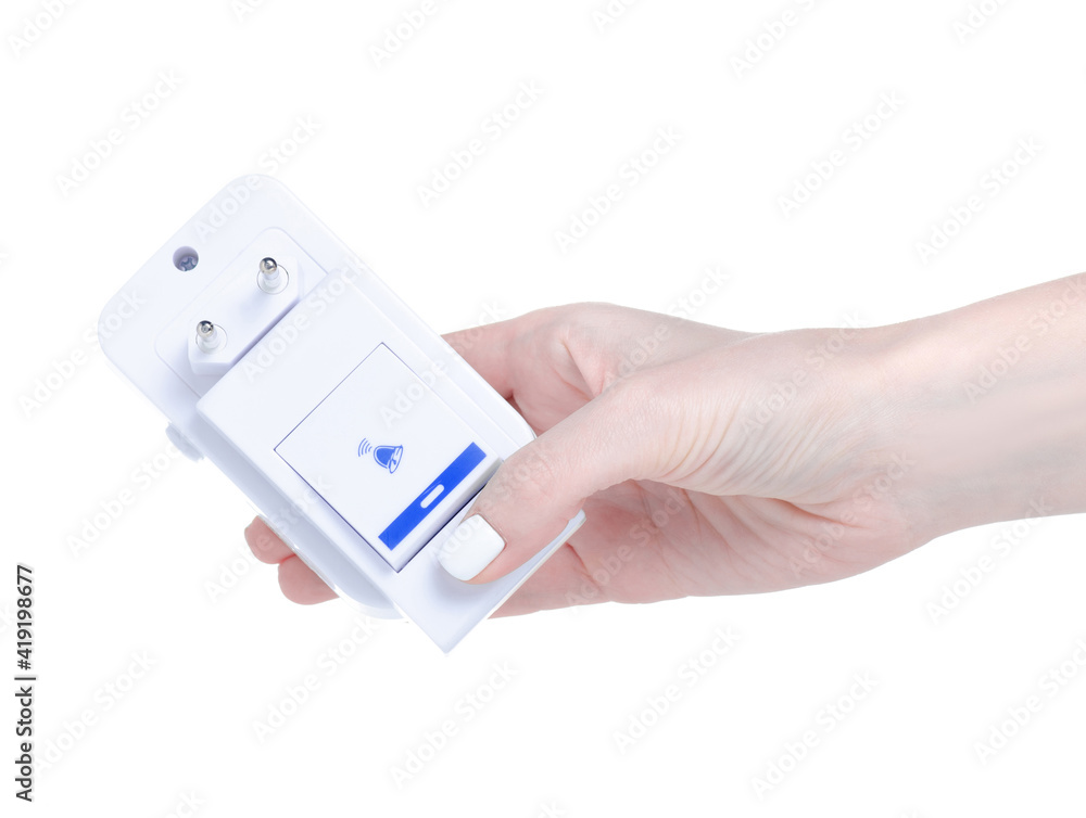 Wireless electrical doorbell in hand on white background isolation Wireless electrical doorbell in hand on white background isolation