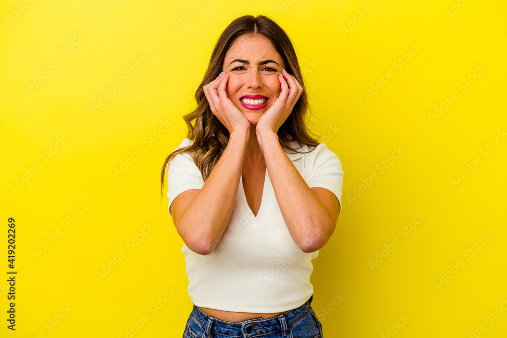 Young caucasian woman isolated on yellow background Young caucasian woman isolated on yellow background