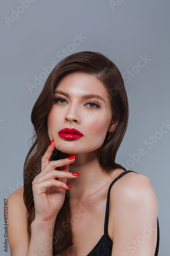 Elegant woman with red lips and beautiful hair