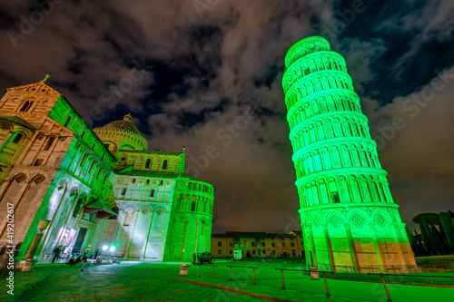 Murais de parede Field of Miracles illuminated on St Patrick's Day, Pisa Leaning Tower, Tuscany -