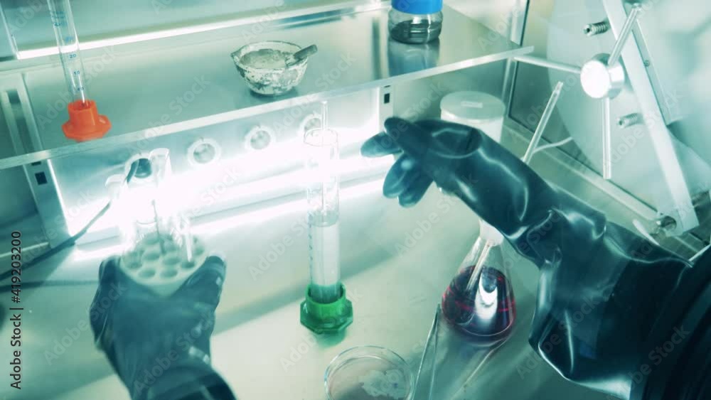 Laboratory cabinet with probes getting analyzed inside of it Laboratory cabinet with probes getting analyzed inside of it