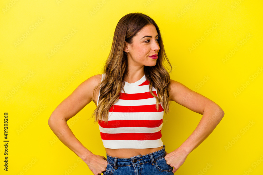 Young caucasian woman isolated on yellow background Young caucasian woman isolated on yellow background