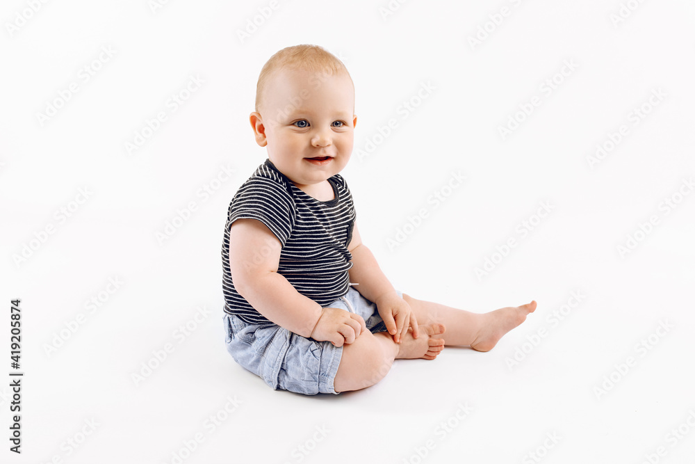 Little happy boy, kid is played on isolated white background Little happy boy, kid is played on isolated white background