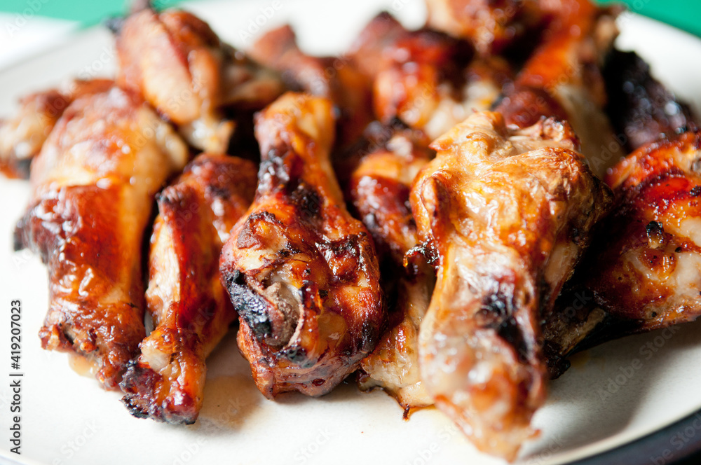 bbq chicken wings and sauce, grilled and tasty finger food
