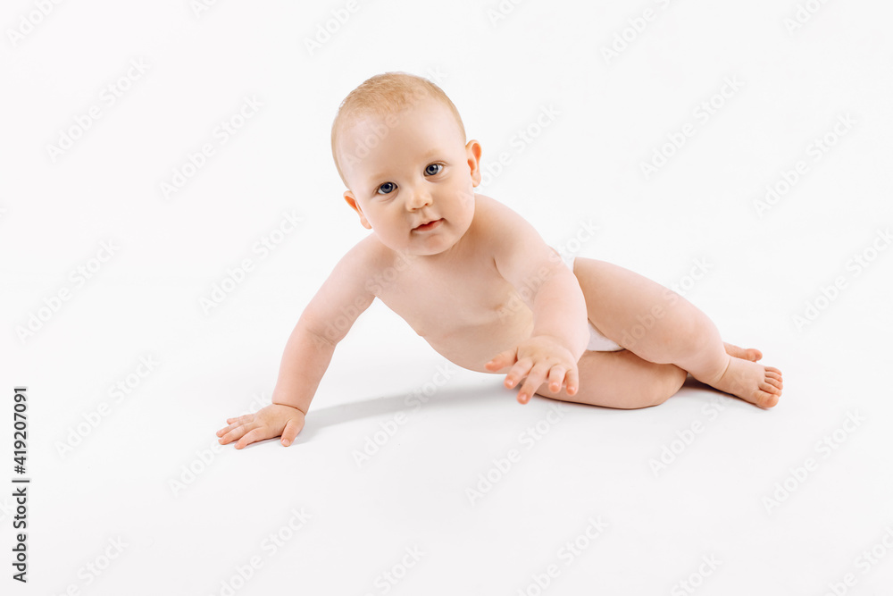 Happy baby in diaper sitting on isolated white background Happy baby in diaper sitting on isolated white background