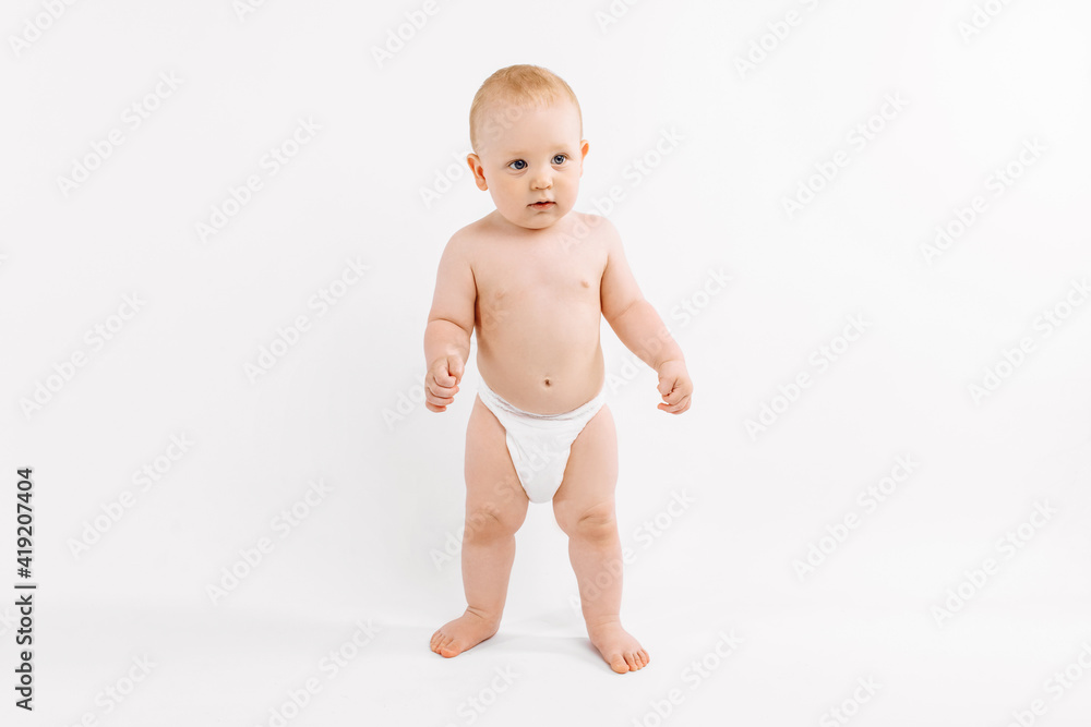 Smiling child standing on white studio background Smiling child standing on white studio background