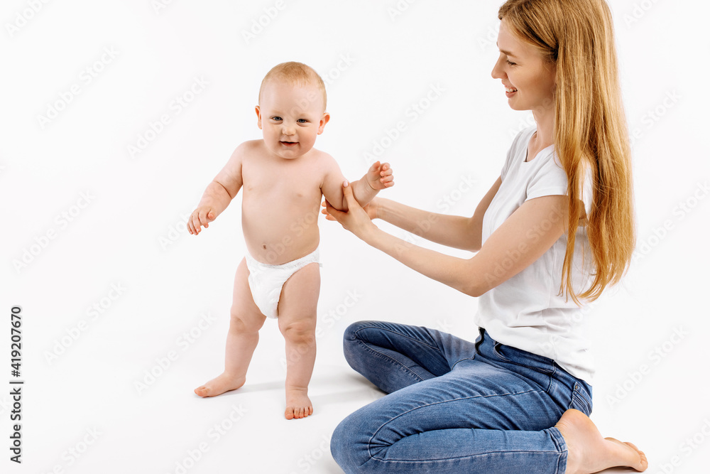 little child learns to walk with the help of the mother, on a white background, little child learns to walk with the help of the mother, on a white background,