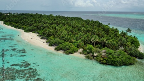 Bird's eye view of tropical islands in the ocean. View of the islands from a drone. Maldives, Thinadhoo (Vaavu Atoll), Dhigurah photo