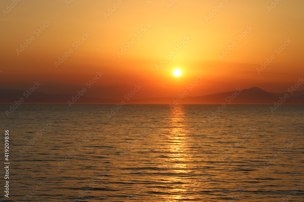 Beautiful Sunset near Cyclades of Aegean Sea in Greece