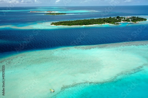 Bird's eye view of tropical islands in the ocean. View of the islands from a drone. Maldives, Thinadhoo (Vaavu Atoll), Dhigurah photo