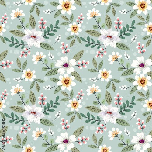 Abstract floral seamless pattern design. Cute hand drawn illustration. White flowers and green leaves on gray background.