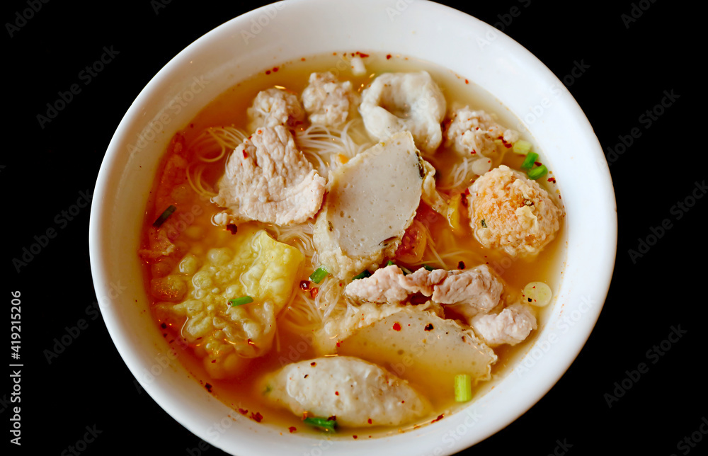 Closeup a Bowl of Thai Rice Noodles Soup with Assorted Fish Balls and Pork
Closeup a Bowl of Thai Rice Noodles Soup with Assorted Fish Balls and Pork