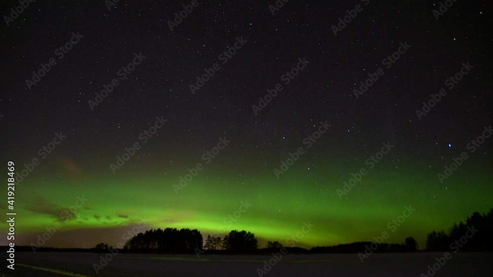 Time lapse of stunning northern lights or aurora borealis. Clear night sky with stars and thin night clouds drifting towards camera. Time lapse of stunning northern lights or aurora borealis. Clear night sky with stars and thin night clouds drifting towards camera.