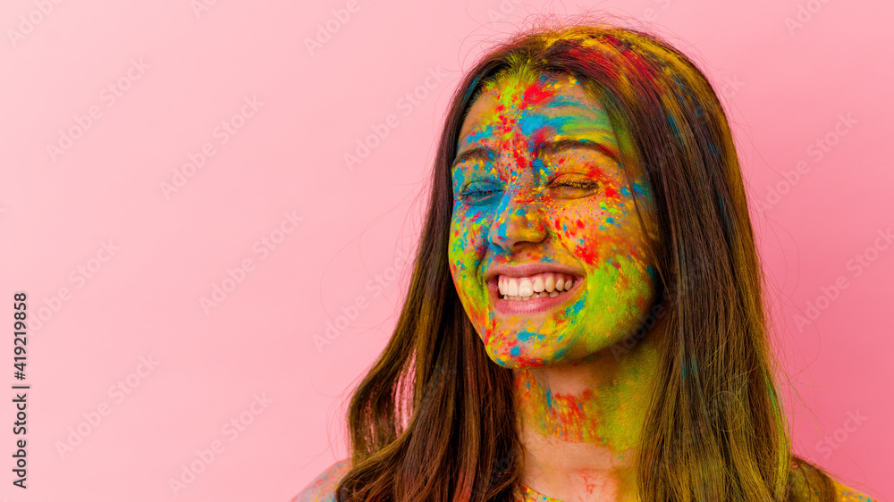 Naklejka premium Young Indian woman celebrating holy festival isolated on white background