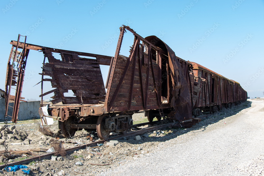 War crime. Train wagon destroyed by rocket fired by the Armenian arm in Agdam. Crash on railway.