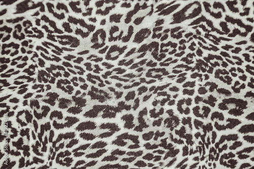 Leopard effect fabric pattern background sample. Leopard print seamless background.