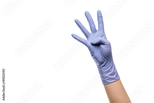 Gesture number four hand with latex glove on white isolated background.