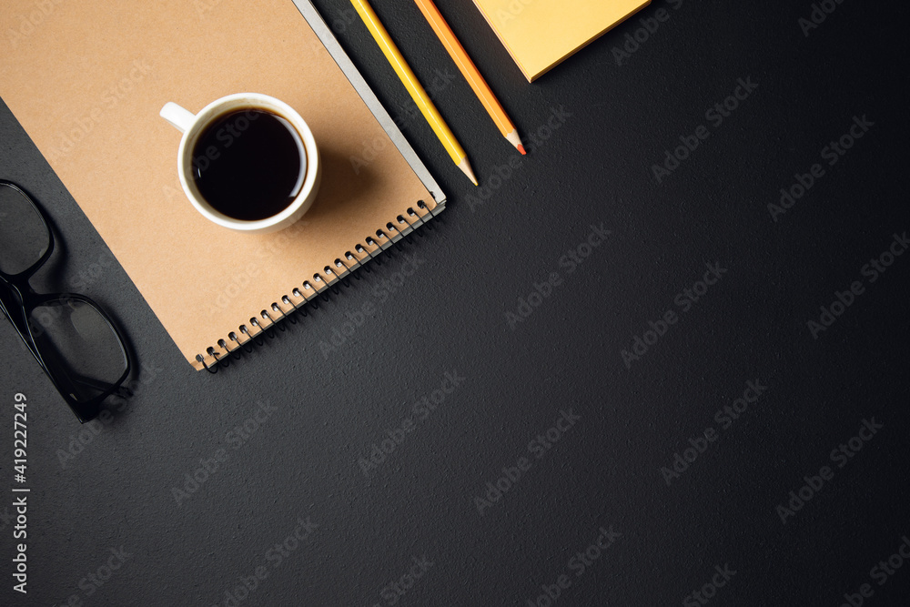 cup of coffee with notepad and pencils on table cup of coffee with notepad and pencils on table