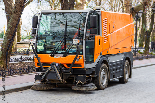 Canvas Print Garbage collection machine on the city streets