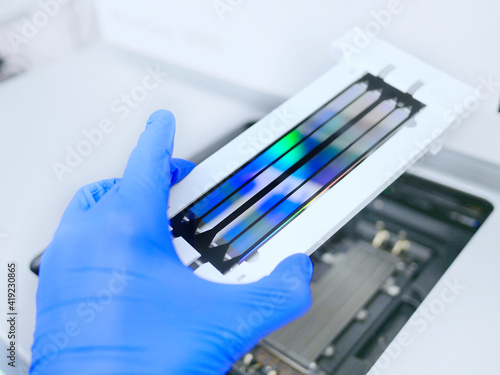 next generation sequencing flow cell. genetic engineering, genetic modification, designer baby and cloning concept. cancer screening and medical technology and therapy