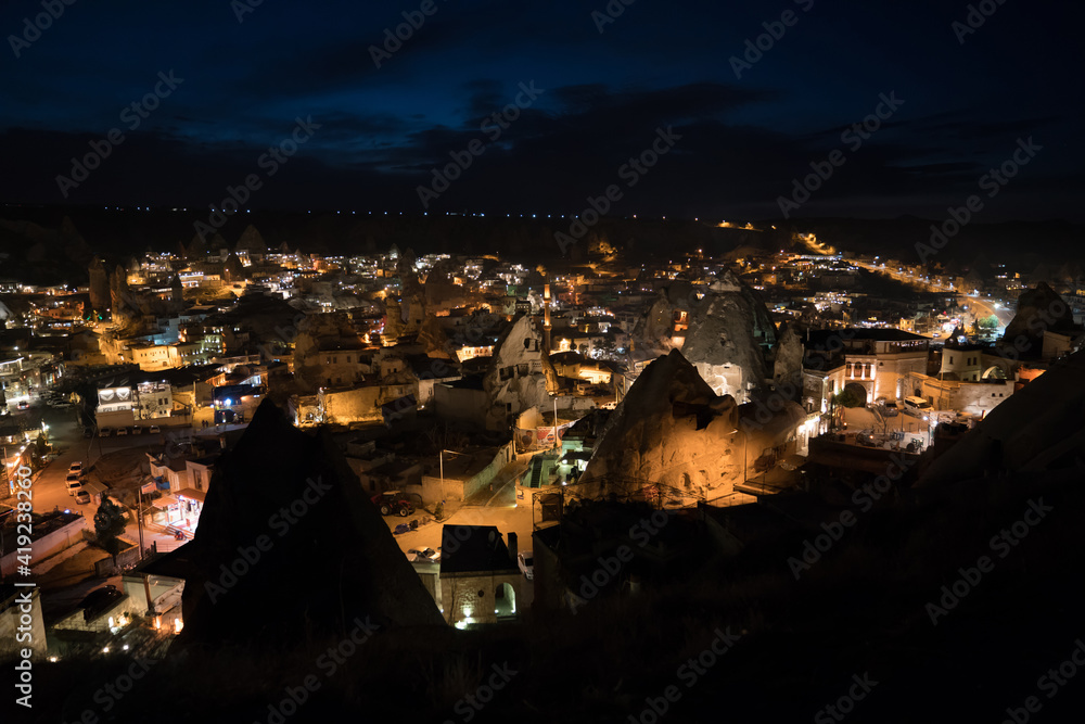 Göreme Cappadocia twilight landscape and the Uchisar Castle in the background. Cappadocia is known worldwide as one of the best places to fly with hot air balloons. Goreme, Cappadocia, Turkey.