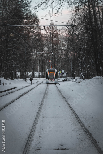 tram, road and tram tracks in winter. Modern tram
