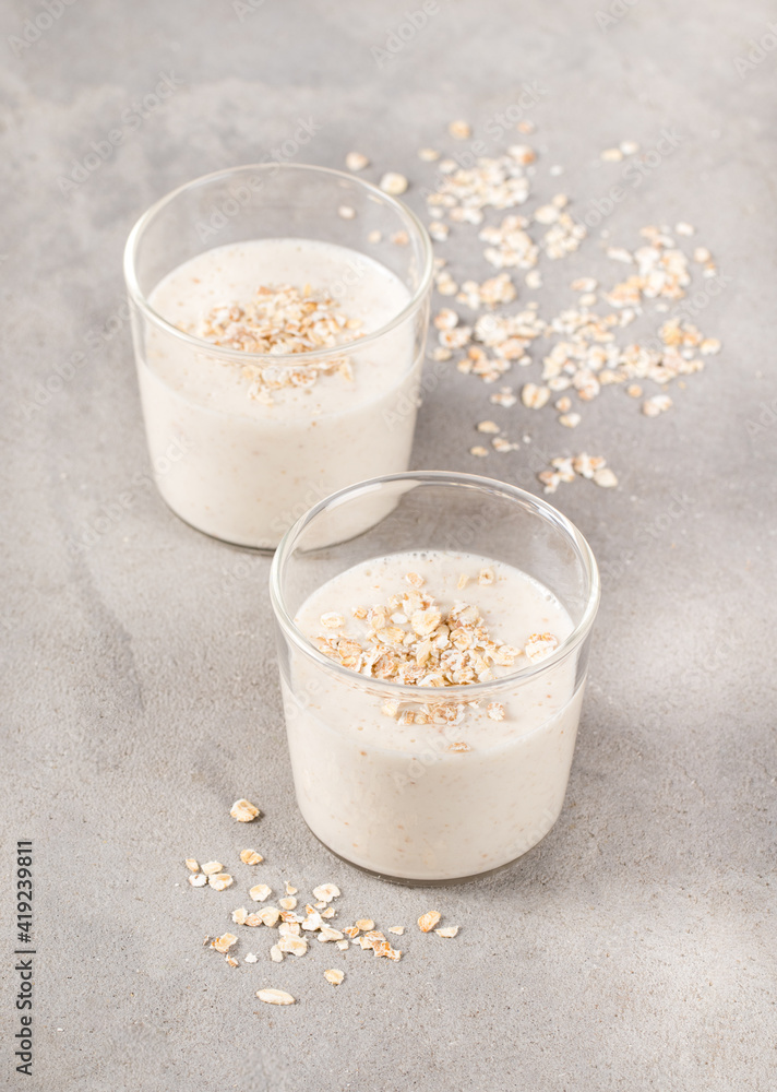 Creamy multigrain pudding in a glass on a light gray background Creamy multigrain pudding in a glass on a light gray background