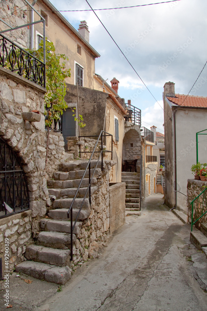 narrow street in the old town / Baska, Croatia