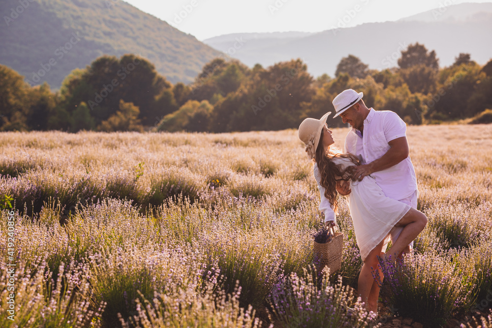 Lovely young couple embracing at the lavender field