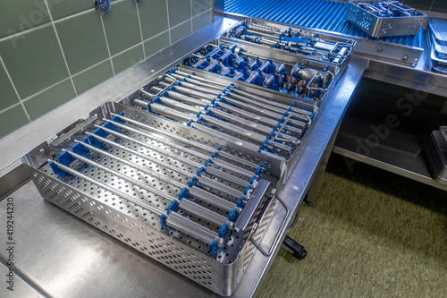 in the sterilization department of a hospital, the instruments for performing a hip prosthesis implantation are prepared