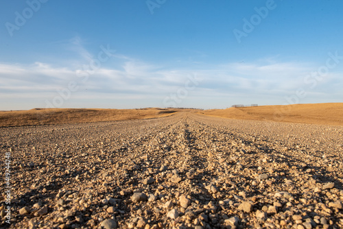 gravel road with blue sky