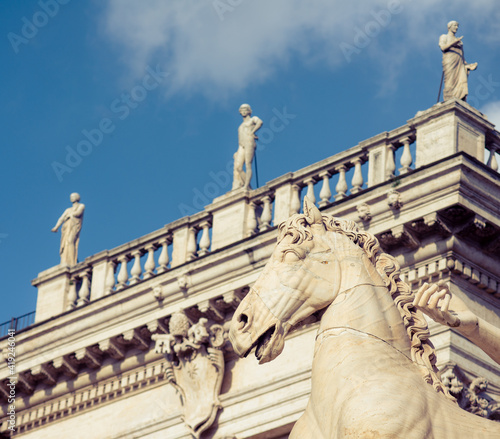 Monument of architecture sculptures of a lion, a wolf, an elephant and birds, ancient rome, their rulers of ancient rome photo