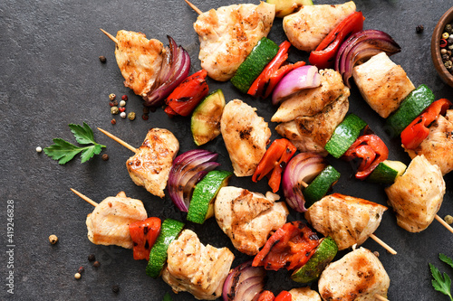 Chicken shashlik and vegetables: peppers, onions, zucchini on skewers. Chicken fillet and grilled vegetables.