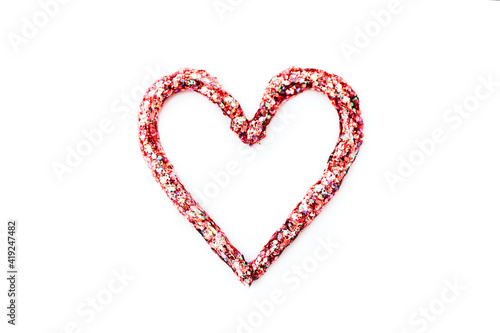 Heart shape from cosmetic gel for a body with glitter and spangles isolated on white