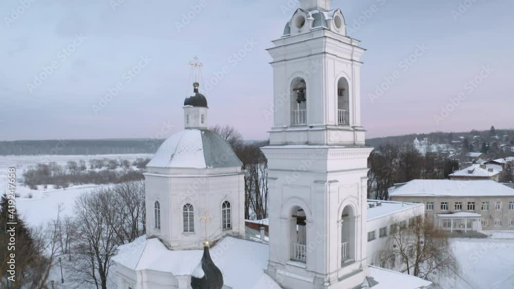 Aerial view of russian winter countryside Tarusa. Flying over village, Orthodox church, River, Snow Aerial view of russian winter countryside Tarusa. Flying over village, Orthodox church, River, Snow