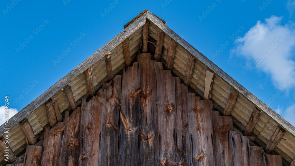 Roof ridge from wooden boards Roof ridge from wooden boards