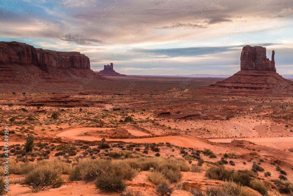 dramatic landscape photo of the spectacular mesa and buttes and rock formations in Monument Valley in the border of Utah and Arizona. dramatic landscape photo of the spectacular mesa and buttes and rock formations in Monument Valley in the border of Utah and Arizona.