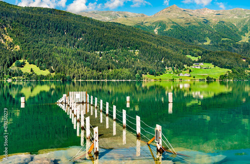 Pier at the Reschensee, an artificial lake in South Tyrol, the Italian Alps