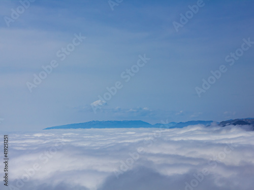 clouds, blue sky, haze over the mountains. © Андрей Яровский