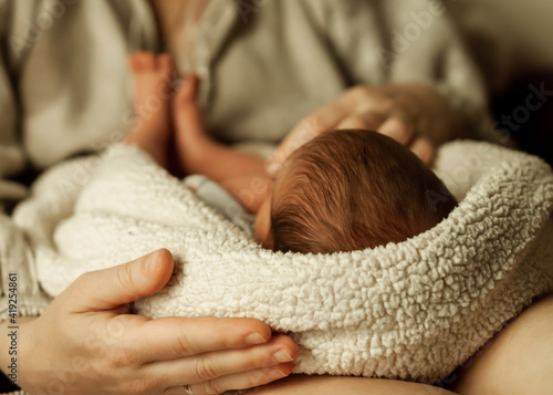 baby in mother's arms