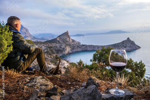 Man outdoors with wine