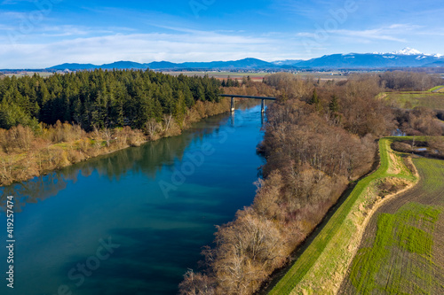 Aerial View of the Skagit River Bridge, Best Rd, Conway, Washington. The south fork of the Skagit River is crossed at Best Rd. and leads to the fertile flower and berry fields of Mt. Vernon, WA.