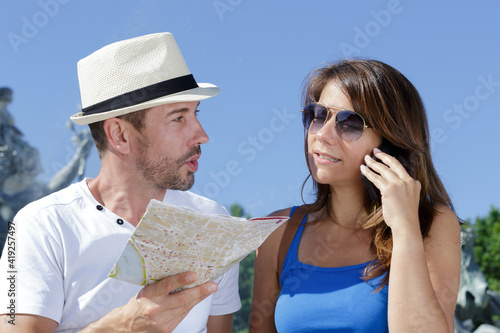 couple in love traveling with a map outdoors